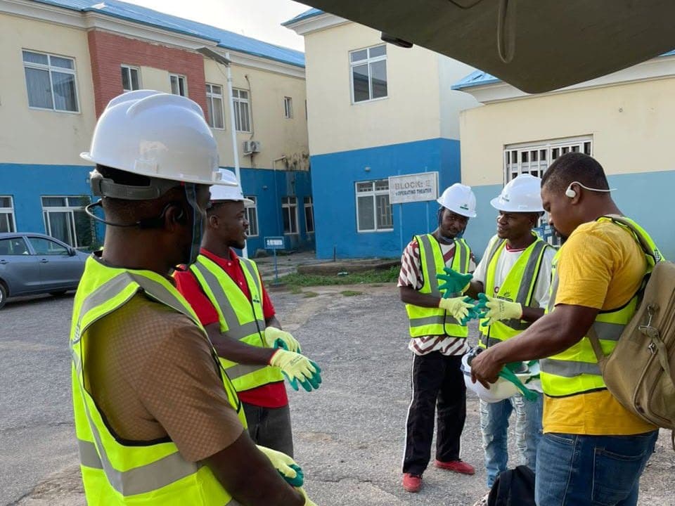 Endlos Energy engineers in hi-vis vests running through the job on site before starting work